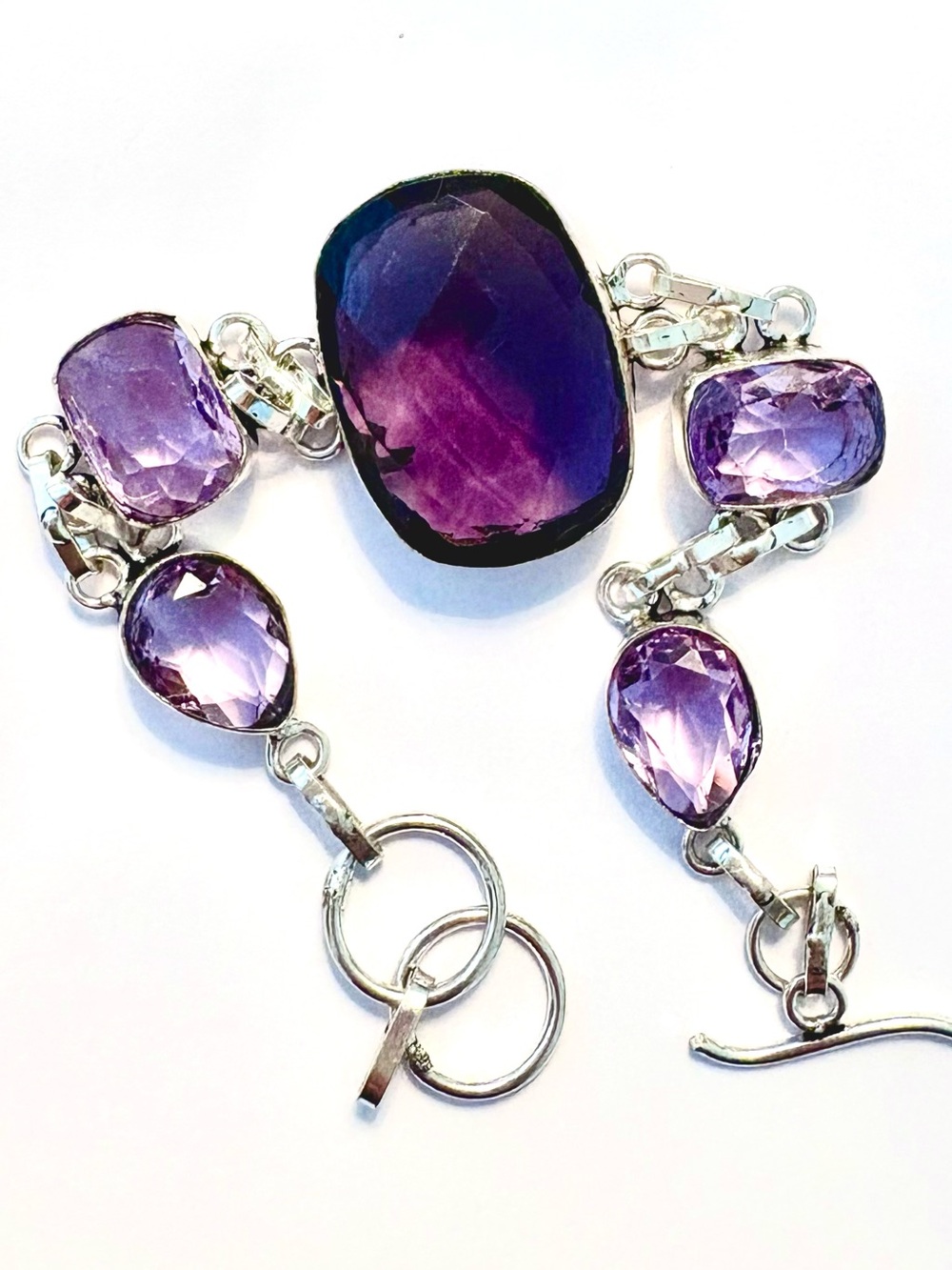 Beautiful, 5 stone, 925 marked, faceted, Purple Amethyst bracelet. Size 7-8